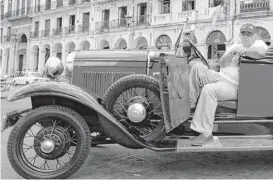  ?? Javier Galeano / Associated Press file ?? This pre-World War II car, with a spare tire attached, was still running in Havana in 2009.