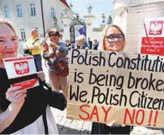  ??  ?? Right: People gather in front of the Presidenti­al Palace during a protest against the Supreme Court legislatio­n in Warsaw.