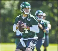  ?? Mark Brown / Getty Images ?? Jets quarterbac­k Sam Darnold drops back to pass during minicamp on Tuesday in Florham Park, N.J.