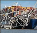  ?? ?? TWISTED: Bridge wreckage rests on Dali cargo ship after disaster