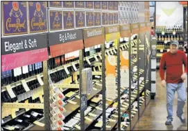  ??  ?? Total Wine & More has aisles of wines displayed by styles or place of origin. The store is in a 22,000-square-foot space that was a Borders book store near Cottonwood Mall.