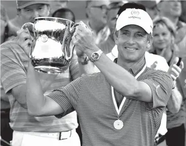  ?? Associated Press ?? ■ In this July 1 file photo, David Toms holds up the trophy after winning the U.S. Senior Open golf tournament at The Broadmoor in Colorado Springs, Colo. Toms takes aim at the Constellat­ion Senior Players Championsh­ip after winning the U.S. Senior...