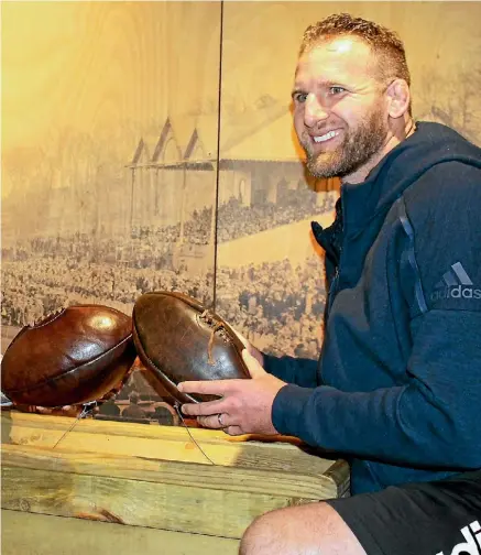  ?? NIGEL MOFFIET ?? These old leather balls caught the eye of All Blacks captain Kieran Read at the Papakura Museum.