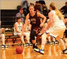  ?? Mike Capshaw/Herald-Leader ?? Siloam Springs senior Kenlie Noel drives baseline while being defended by Pryor (Okla.) High’s Beverly Caraway during Monday’s opening round of the Jerry Oquin Basketball Tournament in Inola, Okla. The Lady Panthers lost 66-61 in overtime.