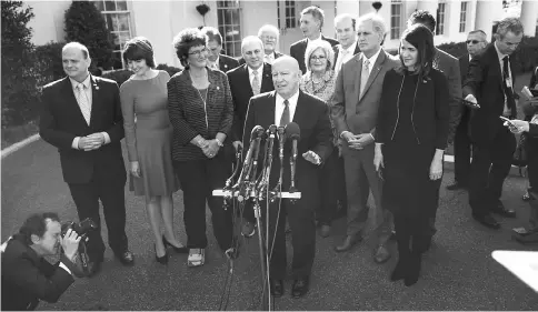  ??  ?? House Ways and Means committee chairman Republican Brady, right, speaks with reporters, accompanie­d by other committee members including House Majority Whip Steve Scalise, Republican, after a meeting with President Donald Trump at the White House in...