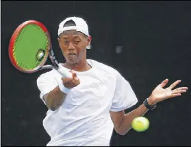  ?? KEVIN C. COX / GETTY IMAGES ?? Christophe­r Eubanks, 19, returns a forehand during his singles-match loss to Radek Stepanek of the Czech Republic during the BB&T Atlanta Open at Atlantic Station on Wednesday.