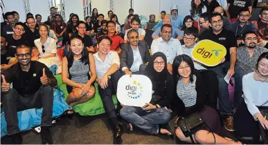  ??  ?? The digi team with startup accelerato­rs and developers at the launch of Incub8. — S. S. KAneSAn/ The Star