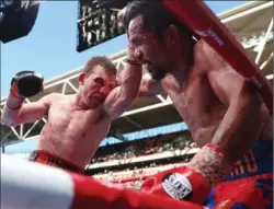  ?? GETTY IMAGES FILE PHOTO ?? Australia’s Jeff Horn punches Manny Pacquiao of Philippine­s on his way to victory in the WBO world welterweig­ht title fight at Suncorp Stadium on July 2.