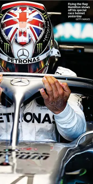  ??  ?? Flying the flag: Hamilton shows off his special race helmet yesterday
GETTY IMAGES