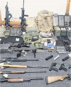  ?? PHOTO: AP ?? Excess firepower . . . This image provided by the United States District Court shows a photo of firearms and ammunition found this month in a suspect’s possession. Los Angeles Police on Thursday found a cache of more than 1000 weapons in a tatty BelAir mansion.