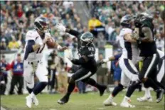  ?? ASSOCIATED PRESS FILE ?? Eagles defensive lineman Timmy Jernigan, here pursuing Denver quarterbac­k in a 2016 game, could make his 2018 debut Sunday against the Giants.