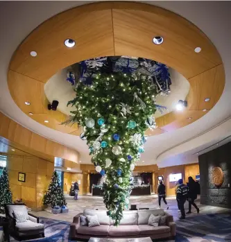  ?? DARRYL DYCK/THE CANADIAN PRESS ?? An upside down Christmas tree is seen suspended from the ceiling at the Fairmont Vancouver Airport hotel in Richmond, B.C., on Monday December 4, 2017.