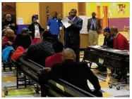  ?? JEREMY P. KELLEY / STAFF ?? Dayton Unit NAACP President Derrick Foward addresses a town hall meeting Monday.