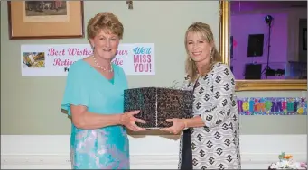  ??  ?? Bridie Carroll (left) accepting a presentati­on from Listowel Arms Hotel’s Patricia O’Callaghan. Photo by John Kelliher.