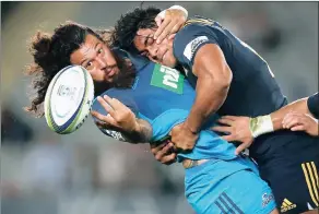  ?? BACKPAGEPI­X ?? BALL-AND-ALL: Rene Ranger is tackled ferociousl­y by Malakai Fekitoa at Eden Park yesterday.