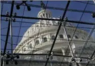  ?? AP PHOTO/J. SCOTT APPLEWHITE ?? The Capitol Dome is seen Thursday through a skylight in the Capitol Visitors Center in Washington. The government shutdown is in many ways wreaking havoc: Hundreds of thousands of federal employees don’t know when they’ll see their next paycheck, and low-income Americans who rely on the federal safety net worry about whether they’ll make ends meet should the stalemate in Washington carry on another month.