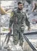  ?? AFP ?? A Syrian fighter after liberating an area in Raqqa from Islamic State.