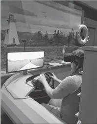  ?? SUBMITTED PHOTO/CINDY MACRAE ?? Melissa Nicholson of Big Baddeck takes a virtual ride on the new “Race The HD4” Hydrofoil Experience at The Alexander Graham Bell Museum in Baddeck