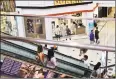  ?? Associated Press ?? Shoppers ride an escalator inside the Glendale Galleria in Glendale, Calif. If a threat of a recession gives you pause when it comes to your personal finances, remember now is a time to prepare, not panic.