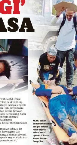  ??  ?? MOHD Sawal diselamatk­an rakan setugas selepas rebah sejurus selesai sertai operasi di Taman Hutan Simpan Sungai Lut.