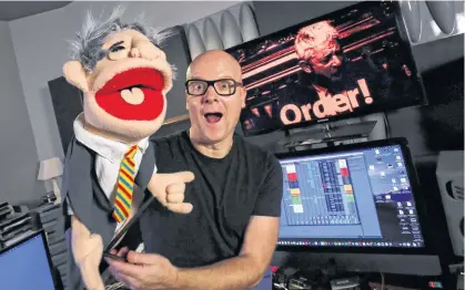  ?? YVES HERMAN • REUTERS ?? Belgian music producer Michael Schack, creator of the track Order, which mixes dance music with former speaker of British House of Commons John Bercow's trademark ripostes, poses with a puppet depicting Bercow in his studio in Antwerp, Belgium.