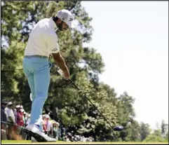  ?? Associated Press ?? Max Homa hits his tee shot on the ninth hole during second round at the Masters golf tournament at Augusta National Golf Club,Friday, in Augusta, Ga.