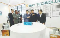  ?? BERNAMAPIC ?? Johor Menteri Besar Datuk Onn Hafiz Ghazi being briefed by Unicomp Technology president Dr Liu Jun (second from right) after the official launch of the smart industrial X-ray inspection specialist plant. On the right is Loh. –