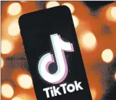  ?? LIONEL BONAVENTUR­E/GETTY-AFP ?? TikTok has become a target of President Donald Trump, who said he would ban the social media app in the U.S.