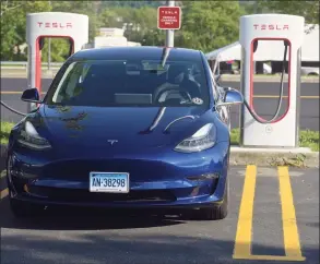  ?? H John Voorhees III / Hearst Connecticu­t Media file photo ?? The Danbury Fair mall celebrated the arrival of a Tesla Supercharg­er Station in July 2018. The 10-stall station, available in the mall’s parking lot, was used by 10 Tesla electric car owners during the event.