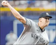  ?? Scott Audette The Associated Press ?? Jameson Taillon blanked the Rays on two hits and no walks over eight innings Friday night in the Yankees’ 2-0 win at Tropicana Field.