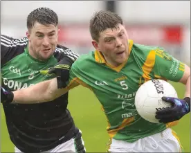  ??  ?? Wing-back Brian O’Neill breaks away from Hugh Byrne, the Blackhill captain.