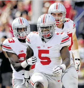  ?? GAIL BURTON / ASSOCIATED PRESS ?? Ohio State linebacker Raekwon McMillan (5) reads his keys, plays with anticipati­on and can cover and read quarterbac­ks’ eyes, according to a scouting report by NFL.com. “He is a tackling machine,” Miami general manager Chris Grier said. “He is a big...