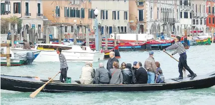  ?? RICK STEVES ?? In Venice, only three “traghetti” still ferry voyagers across the Grand Canal from establishe­d stops.