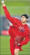  ?? AP PHOTO ?? Los Angeles Angels pitcher Shohei Ohtani throws during a spring training baseball workout Tuesday in Tempe, Ariz.