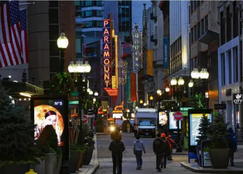  ?? PAT GREENHOUSE/GLOBE STAFF ?? Pedestrian­s walked through Downtown Crossing on Nov. 23, 2020.