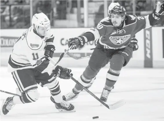  ??  ?? Royals captain Matthew Phillips cuts around Tri-City’s James Maxwell in Game 1 action Friday night at Save-on-Foods Memorial Centre.