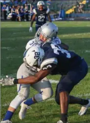  ?? ERIC BONZAR — THE MORNING JOURNAL ?? Midview receiver Ben Gendics is hit after the catch by Lorain defensive back Savon Chavis in the first quarter.