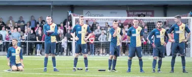  ??  ?? Shootout drama The East Kilbride players look on during their bonus point victory over top flight St Mirren