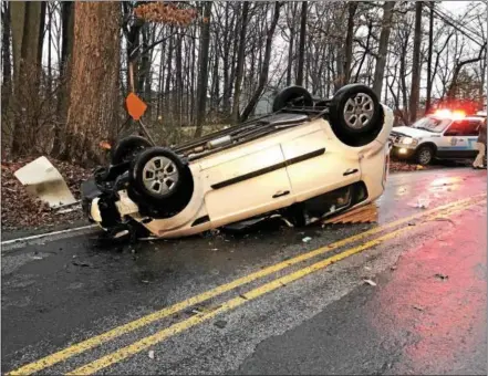  ?? SUBMITTED PHOTO — MARK WALSH/IRISH EYEZ PHOTOGRAPH­Y ?? Caln Township Police Department, Thorndale Volunteer Fire Department and the Coatesvill­e Veterans Affairs Fire Department responded to a storm-related vehicle crash on North Caln Road on Monday. Crews extricated the driver from the vehicle. He was...