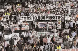  ??  ?? Drivers working for companies like Uber and Cabify march during a protest in Madrid, Spain, Thursday, Sept. 27, 2018. Hundreds of black vehicles of app- based