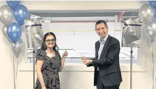  ??  ?? ●●Iolanda Di Paola, homecare patient, and Andy Goldney, general manager at Baxter UK, Ireland and Nordic, officially opening the new unit