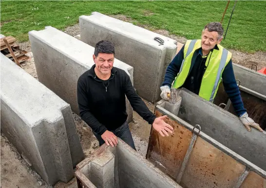  ?? PHOTO: MYTCHALL BRANSGROVE/FAIRFAX NZ. ?? Waimate 50 chairman Robert Aikman, left, here with concrete barrier builder Trevor Joyce, has one eye on the future of the well-supported event as some costs continue to climb.