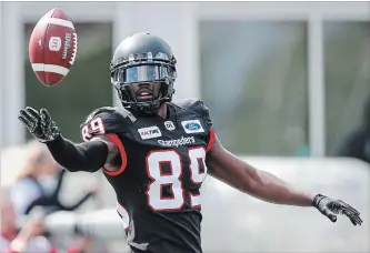  ?? JEFF MCINTOSH THE CANADIAN PRESS ?? Stampeders’ DaVaris Daniels celebrates his touchdown in first-half CFL action against Edmonton on Monday.