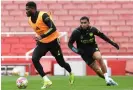  ?? ?? Thomas Partey (left) gets away from Reiss Nelson in an Arsenal training session at Emirates Stadium on Wednesday. Photograph: Stuart MacFarlane/Arsenal FC/Getty Images