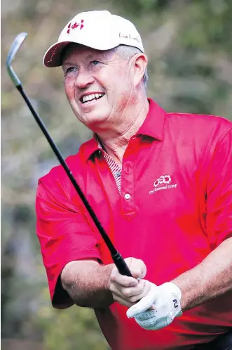  ?? THE CANADIAN PRESS/FILES ?? Canadian Rod Spittle follows the flight of his tee shot on the 14th hole en route to shooting a 4-under 66, just two shots off the lead, in first-round action at the PGA Champions Shaw Charity Classic.