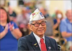  ?? MATIAS J. OCNER/Miami Herald/TNS ?? U.S. Army Air Forces veteran Richard Goon, 98, middle, is congratula­ted after receiving the Congressio­nal Gold Medal during a virtual ceremony at the Grand Villa Senior Living Community on Tuesday in Deerfield Beach, Florida.