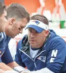  ?? GREG M. COOPER/USA TODAY SPORTS ?? The Patriots’ Josh McDaniels, talking with Tom Brady, backed out on the Colts.