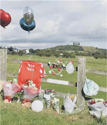  ??  ?? Floral tributes left on Chislehurs­t Road, Penshaw.