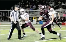  ?? MARK HUMPHREY ENTERPRISE-LEADER ?? Lincoln 2018 graduate Braden Umberson, shown running the ball against Huntsville, receives Male Athlete of the Year honors for the 20172018 school year at Lincoln. Umberson played football and basketball. He was named All-Conference in football catching 93 passes for 1,105 yards and 12 touchdowns averaging 11.9-yards-per-catch. He ran the football 72 times for 310 yards, averaging 4.3-yards-per-carry.