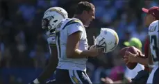  ?? AP PHOTO/MARK J. TERRILL ?? Los Angeles Chargers quarterbac­k Philip Rivers reacts as he comes off the field during the second half of an NFL football game against the Philadelph­ia Eagles on Sunday in Carson.